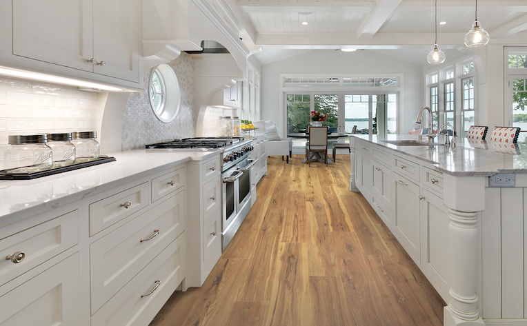 wood-look laminate floor in white kitchen with island